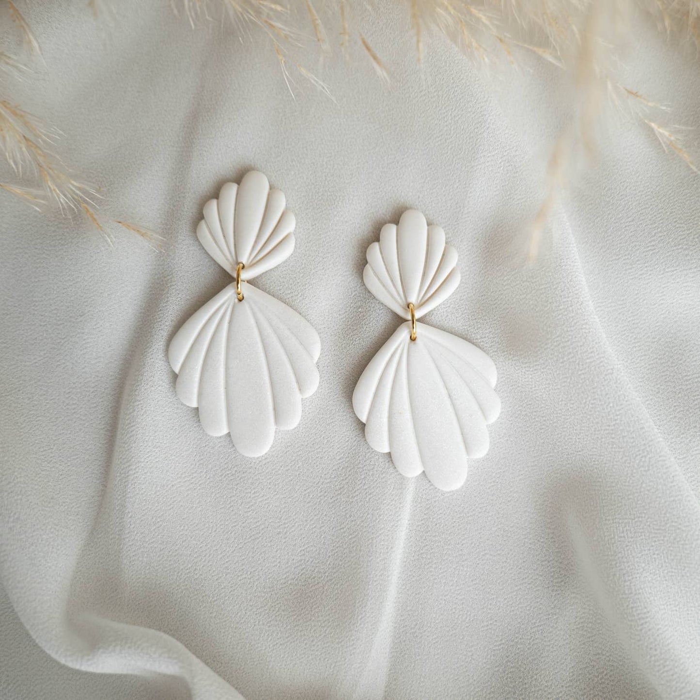White shell shape earrings