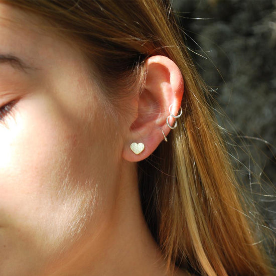 Load image into Gallery viewer, Small Silver Heart Earrings Lifestyle
