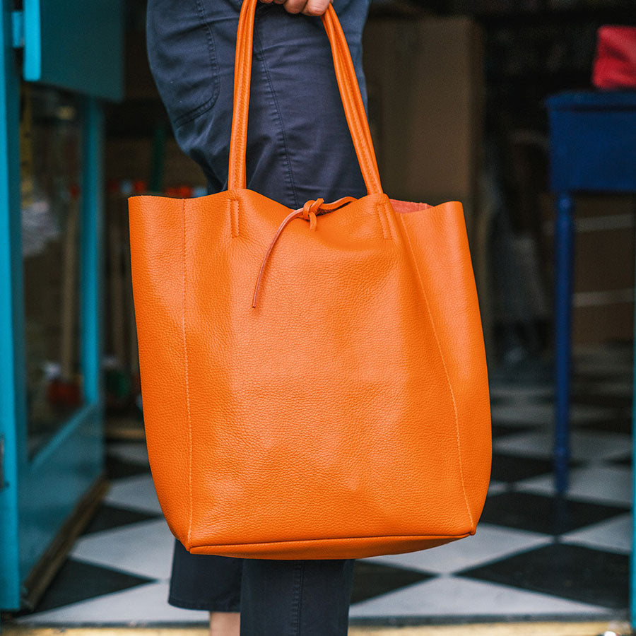 Orange best sale leather handbag